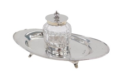 Lot 82 - A Victorian silver inkwell, the cut glass...