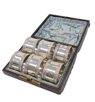 Lot 84 - A set of six Victorian silver napkin...
