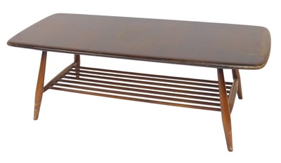 Lot 516 - An Ercol dark elm coffee table, the...