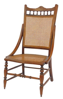 Lot 518 - An Edwardian oak framed chair, with a cane...
