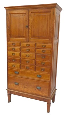 Lot 563 - An early 20thC oak filing cabinet, the top...