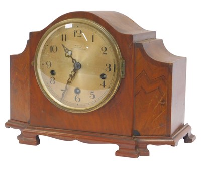 Lot 585 - An Art Deco walnut cased mantel clock, the...