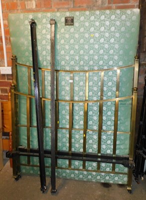Lot 1130 - A brass double bed frame and mattress.