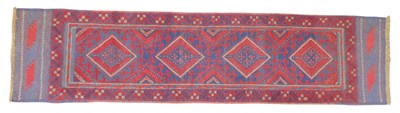 Lot 611 - A Persian red ground runner, decorated with...