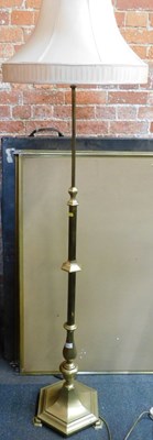 Lot 1116 - A brass standard lamp, with shade. WARNING!...