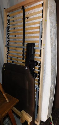 Lot 1082 - A single electric bed, with a brown faux...