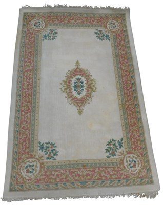 Lot 603 - An Indian rug, cream ground decorated with a...