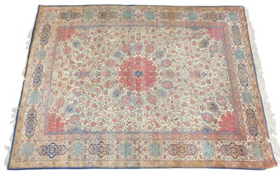 Lot 604 - A Kirman rug, pale green ground with a central...