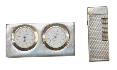 Lot 600 - A Dunhill cigarette lighter, in an engine...