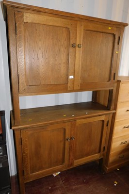 Lot 1097 - A pair of oak side cabinets, each with a...