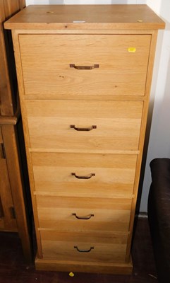 Lot 1098 - A contemporary oak five drawer narrow chest,...