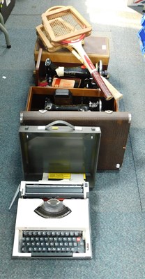Lot 2181 - A cased sewing machine, manual, and another...