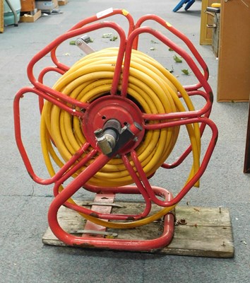 Lot 2190 - An outside hose reel with hose.