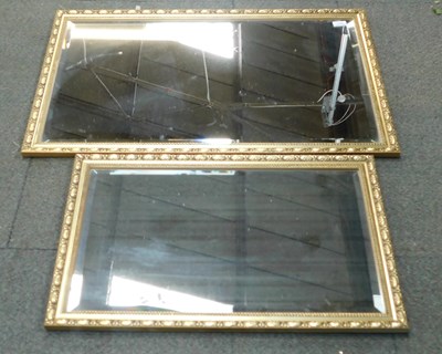 Lot 2192 - Two gilt framed rectangular bevelled mirrors.