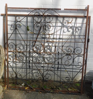Lot 1127 - A pair of black painted wrought iron...