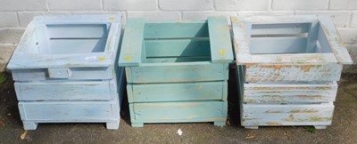 Lot 1128 - Three painted wooden garden planters.