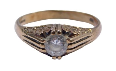Lot 132 - A 9ct gold solitaire ring, set with a round...