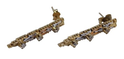 Lot 573 - A pair of tricolour drop earrings, with gold,...
