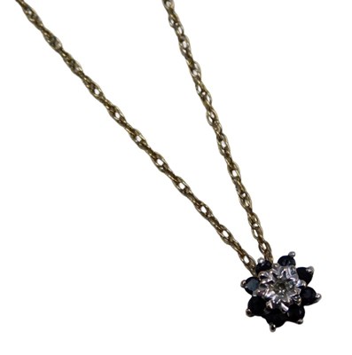 Lot 575 - A 9ct gold pendant and chain, the floral...