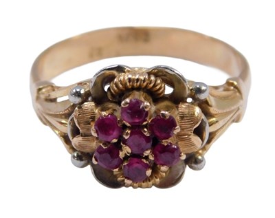 Lot 144 - A garnet cluster ring, set with seven round...