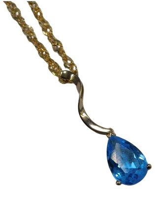 Lot 221 - A blue topaz pendant and chain, the teardrop...