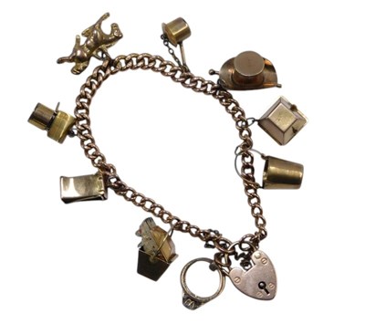 Lot 386 - A 9ct gold charm bracelet, with curb link...