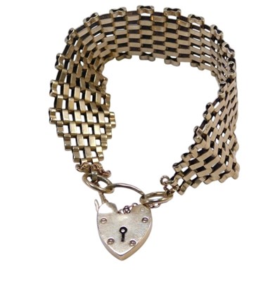 Lot 387 - A 9ct gold gate bracelet, of six bar design,...