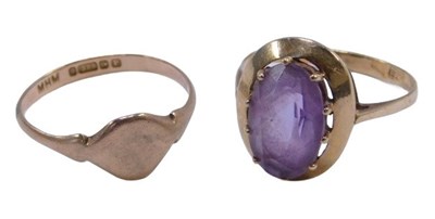 Lot 393 - Two dress rings, comprising a oval amethyst...
