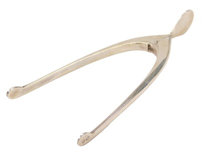 Lot 160 - A pair of Edward VIII silver wishbone sugar...