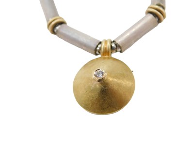 Lot 456 - A diamond pendant and chain, with brushed...