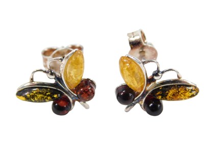 Lot 470 - A pair of amber set butterfly earrings, on...