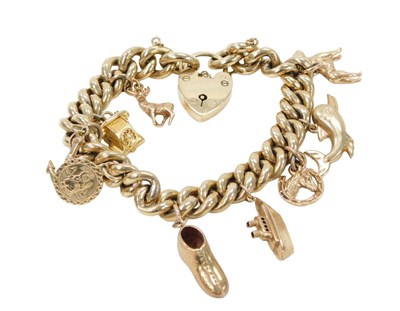 Lot 424 - A 9ct gold curb link charm bracelet, with...