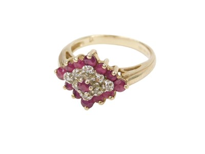 Lot 216 - A 9ct gold cluster ring, set with garnets and...
