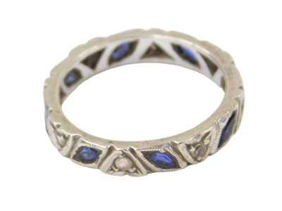 Lot 218 - An eternity ring, set with sapphire and...