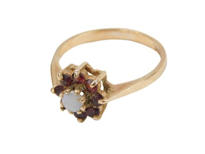 Lot 220 - A 9ct gold garnet and opal cluster ring, set...