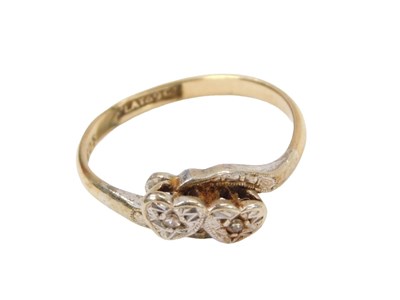 Lot 222 - A diamond twist ring, the two illusion set...