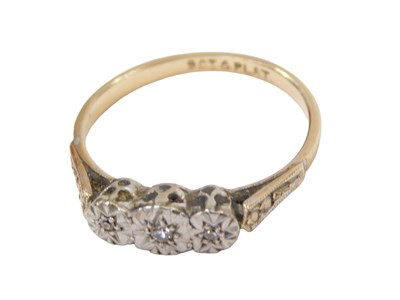 Lot 228 - A diamond three stone ring, set with three...