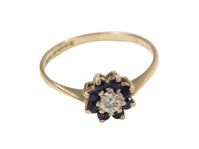 Lot 243 - A 9ct gold cluster ring, set with central tiny...