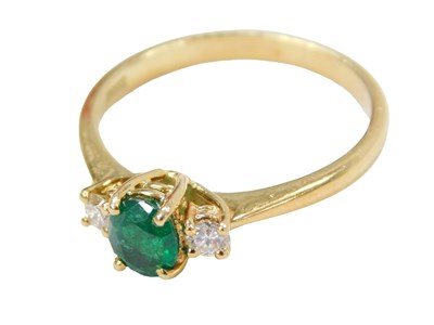 Lot 244 - An 18ct gold emerald and diamond dress ring,...