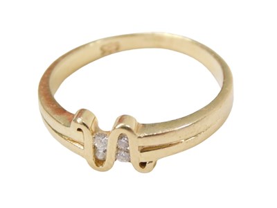 Lot 245 - A diamond set dress ring, the central wave set...