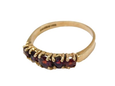 Lot 247 - A 9ct gold garnet dress ring, set with five...