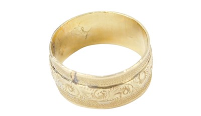 Lot 232 - An 18ct gold wedding band, with central floral...