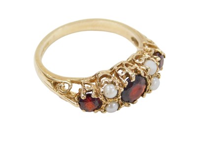 Lot 263 - A 9ct gold garnet and seed pearl dress ring,...