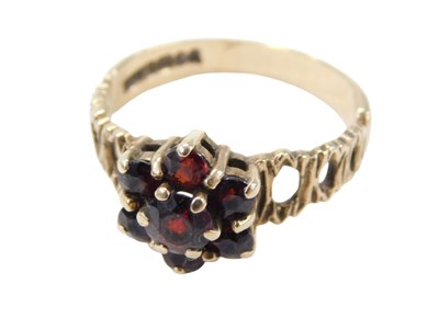 Lot 278 - A 9ct gold garnet cluster ring, set with seven...