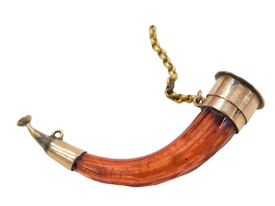 Lot 428 - A miniature horn shaped scent bottle, set with...