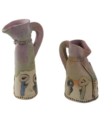 Lot 303 - Two studio pottery vases, each on a cream and...