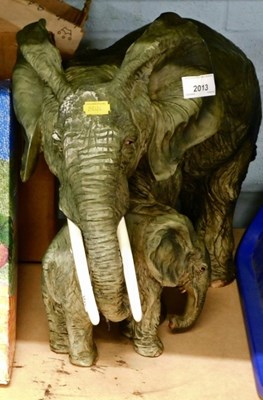 Lot 2013 - A resin model of an elephant, together with...