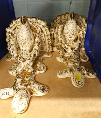 Lot 2016 - A pair of white glaze wall brackets, with gold...