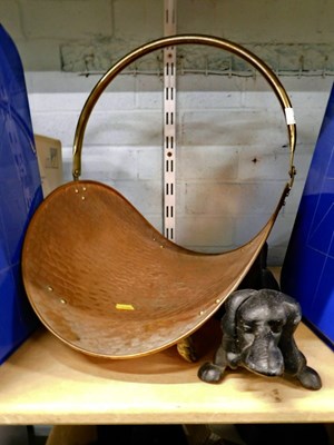 Lot 2021 - A concave copper log basket, with brass handle,...
