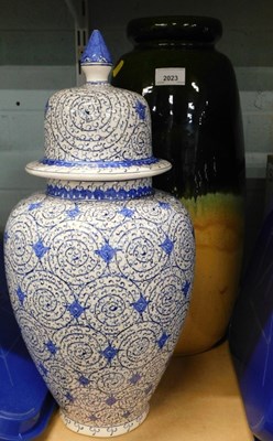 Lot 2023 - A tall semi green glazed studio pottery...
